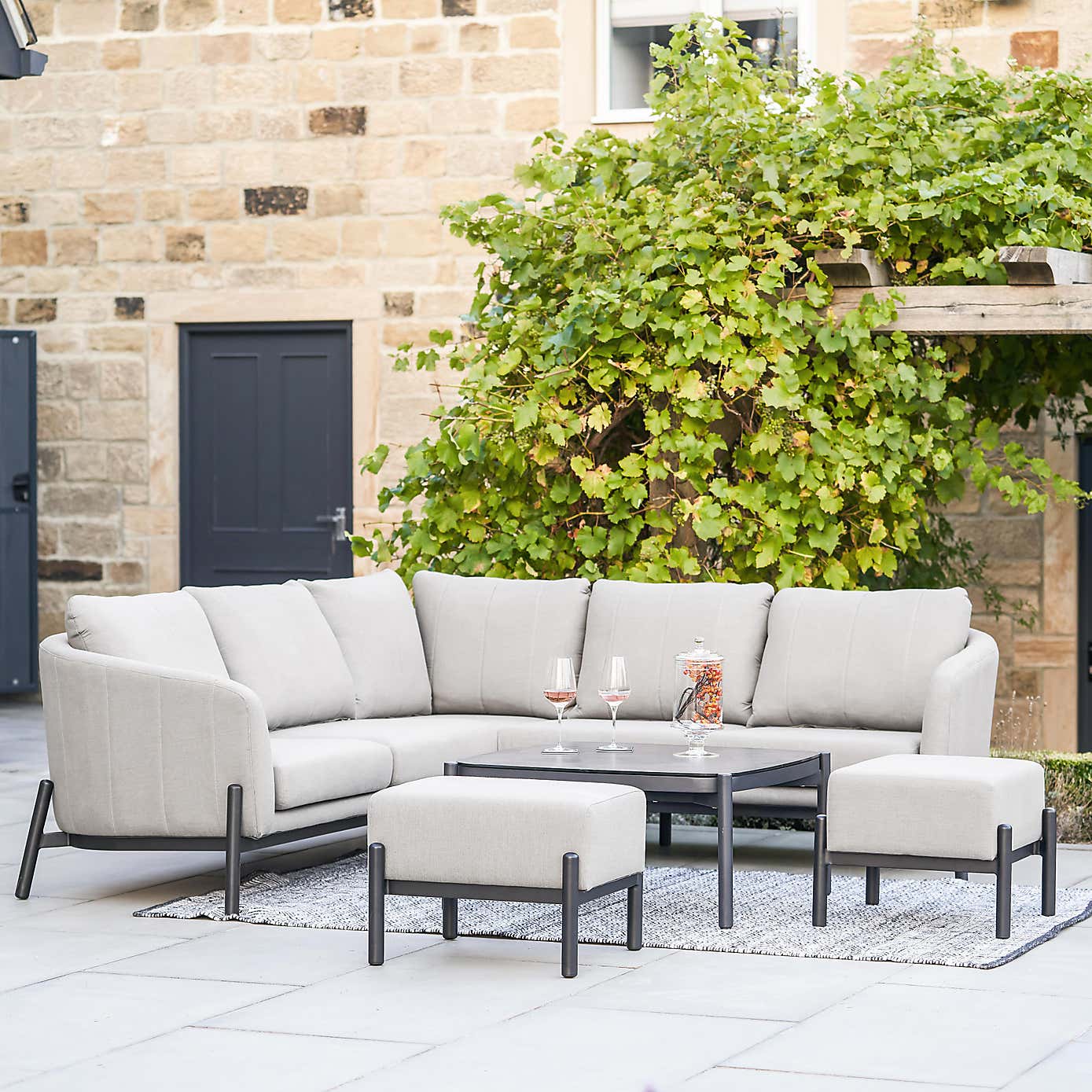 Pacific Lifestyle Nevada Putty Small Outdoor Corner Seating Set with Coffee Table and Footstools