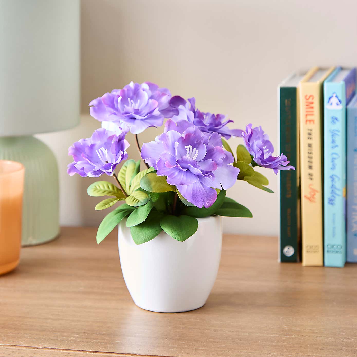 Artificial Blossom Floral in White Ceramic Plant Pot